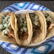 Finished tacos. Salsa verde is not pictured because it must be applied immediately prior to taco consumption. Yes, they’re on a paper plate to approximate the family backyard barbecue experience, and because I’m ghetto like that.